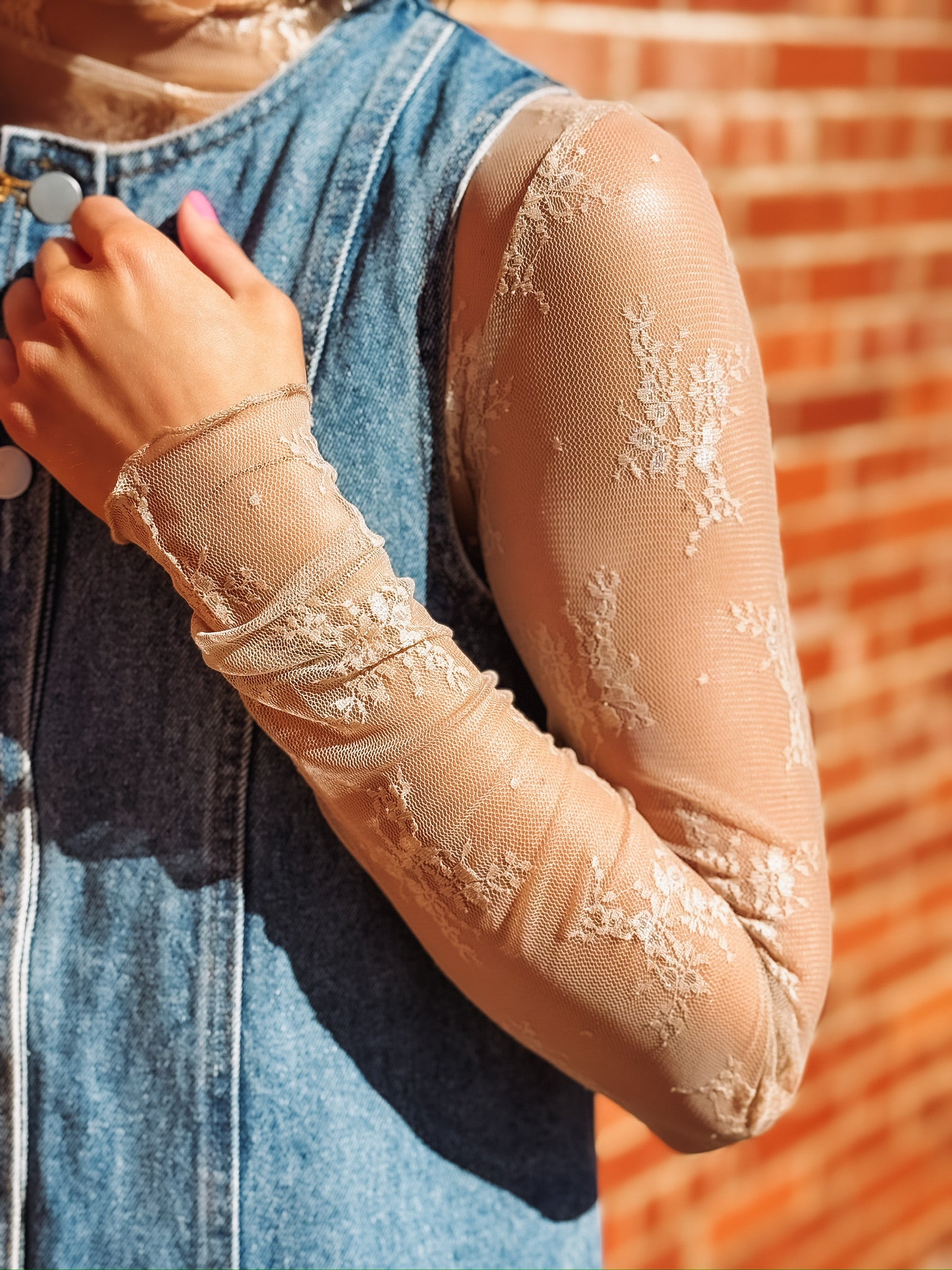 Beige sheer floral mock neck layering top.