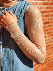 Beige sheer floral mock neck layering top.