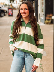 Green and cream striped quarter-zip pullover.