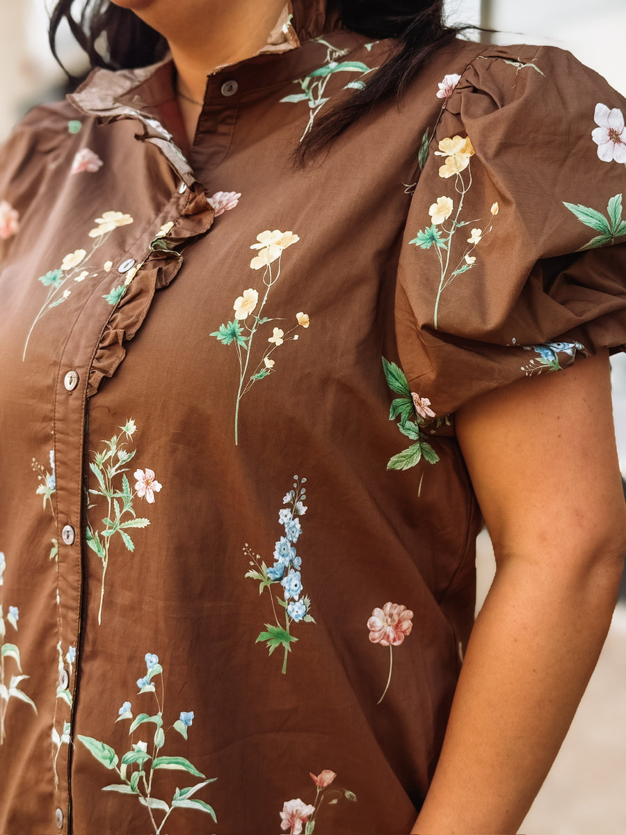 Brown floral button up mini dress dress with high ruffled neckline and puff short sleeves.