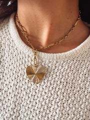 Short chain link necklace with a drop down pave heart pendant.