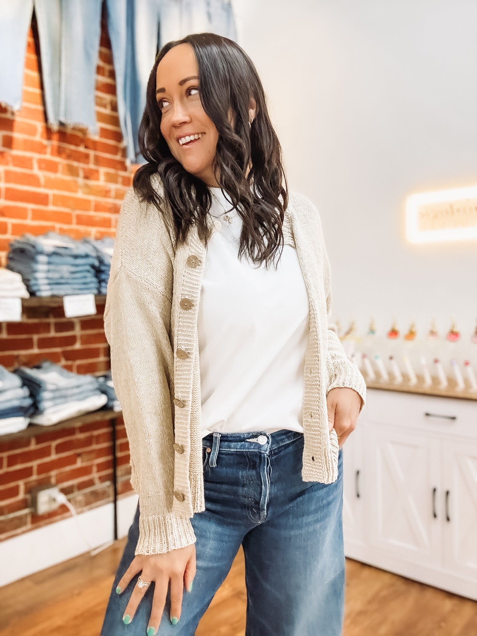 Ecru button up long sleeve cardigan with wooden detailed buttons.