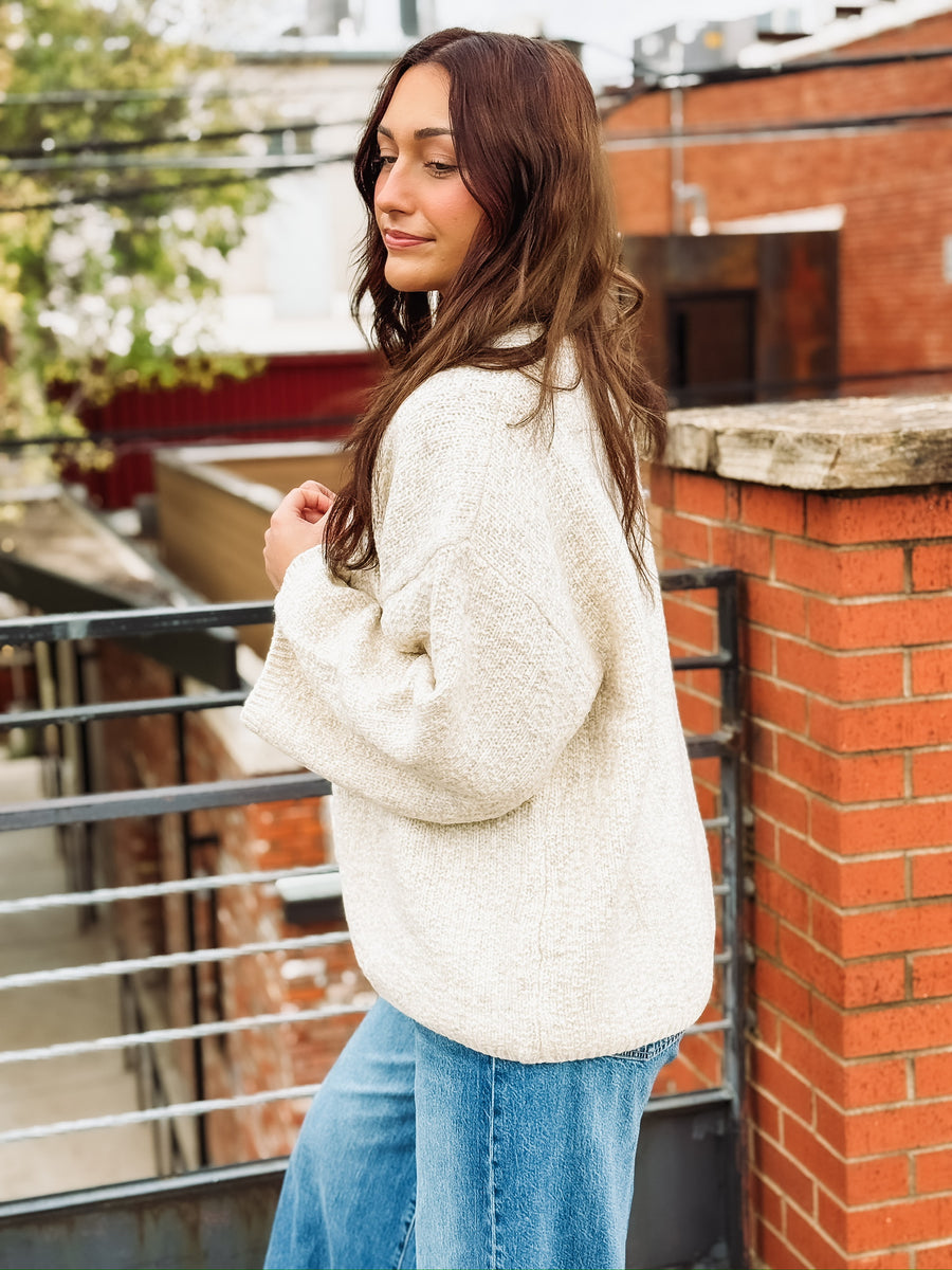 Soft, bubble-cut open-front cardigan with relaxed billowy sleeves and a cozy, refined texture.