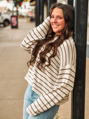 Brown and cream striped long sleeve sweater.