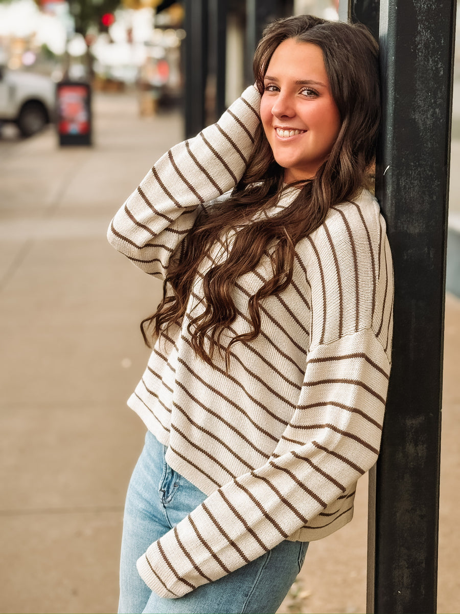 Brown and cream striped long sleeve sweater.