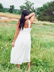White eyelet sleeveless midi dress.
