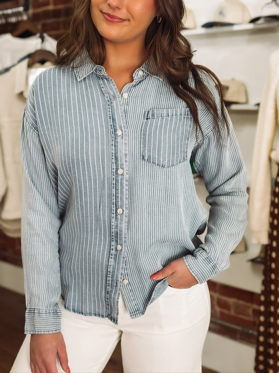 Light wash denim blouse with multi white stripes and button-up front