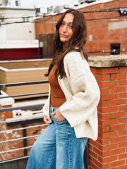 Soft, bubble-cut open-front cardigan with relaxed billowy sleeves and a cozy, refined texture.