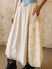 Feminine cream lace skirt featuring delicate embroidery and layered ruffles