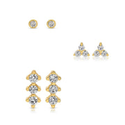 Gold and crystal stud earrings on a white background