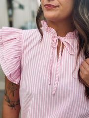 Pink ruffle sleeve pinstriped blouse with a ruffle neckline and a self tie detail.