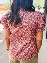 Blouse with a band collar with a wine, pink, and olive colored geometric print