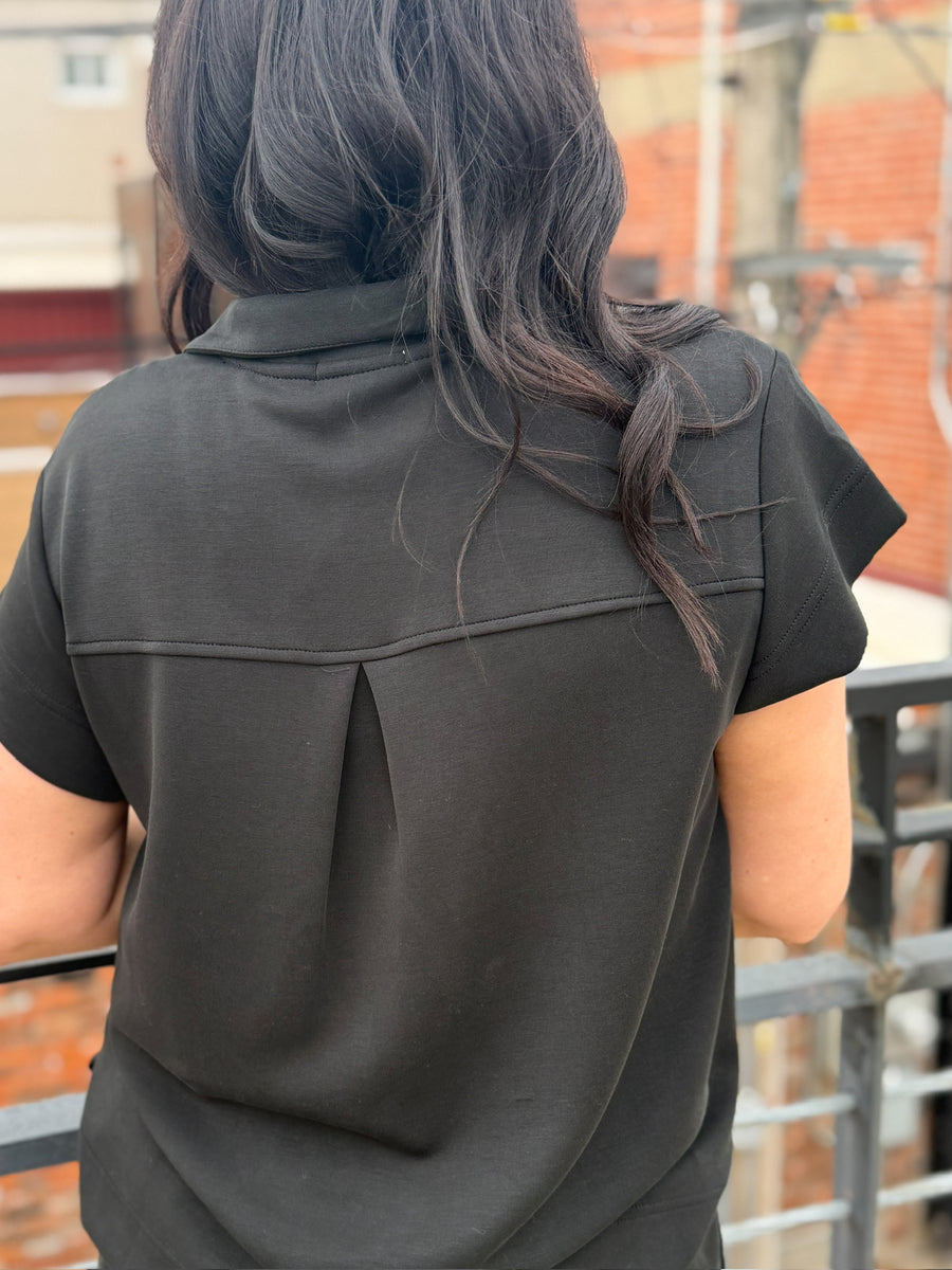 Black short sleeve scuba short set with gold sipper and end cap details from Mary Square.