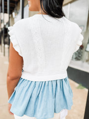 Soft knit short sleeve sweater with ruffle sleeves and peplum denim looking details with side bow detailing.