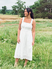 White eyelet sleeveless midi dress.