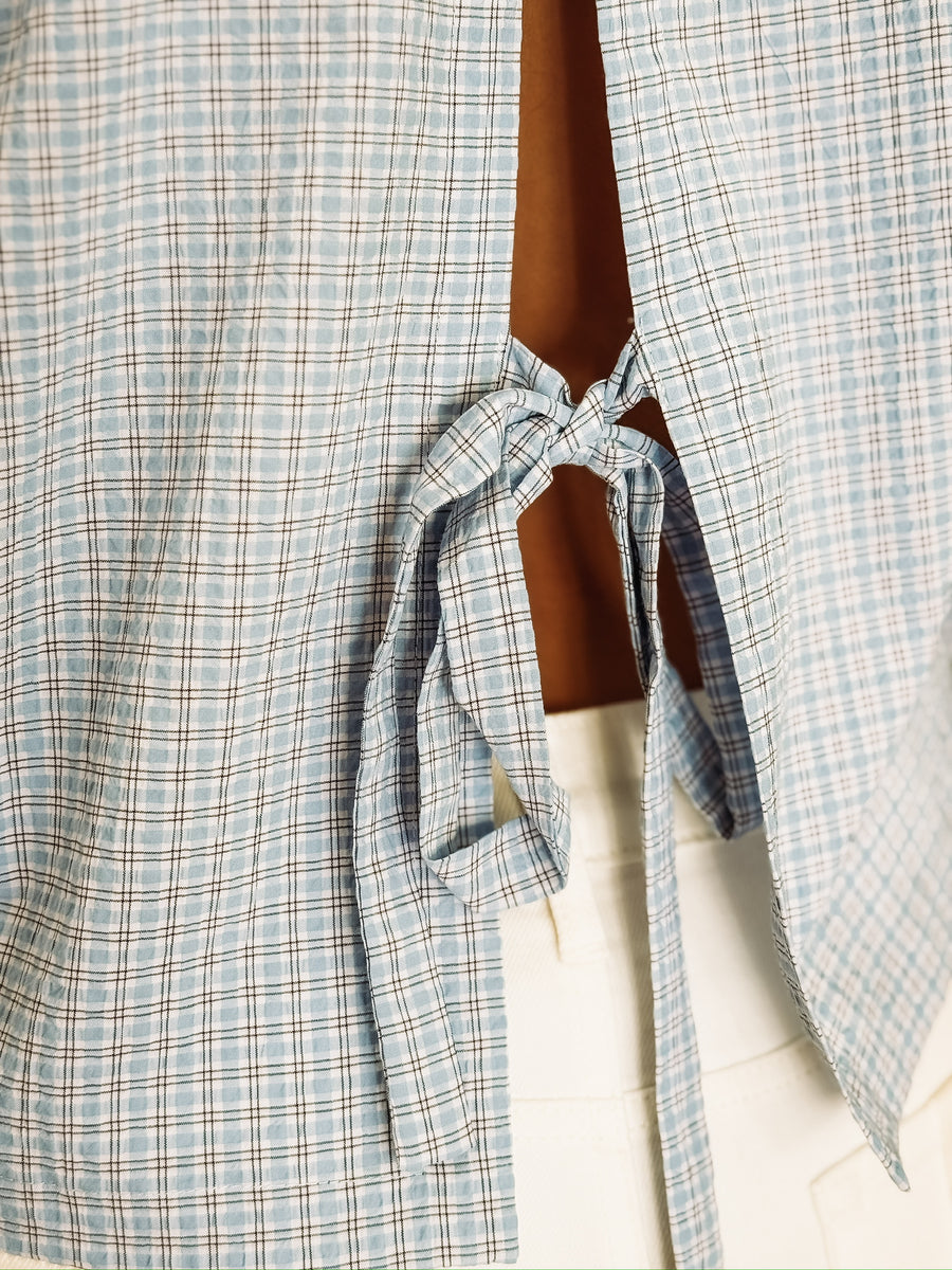 Cropped plaid button up long sleeve with slit tie detail in the back.