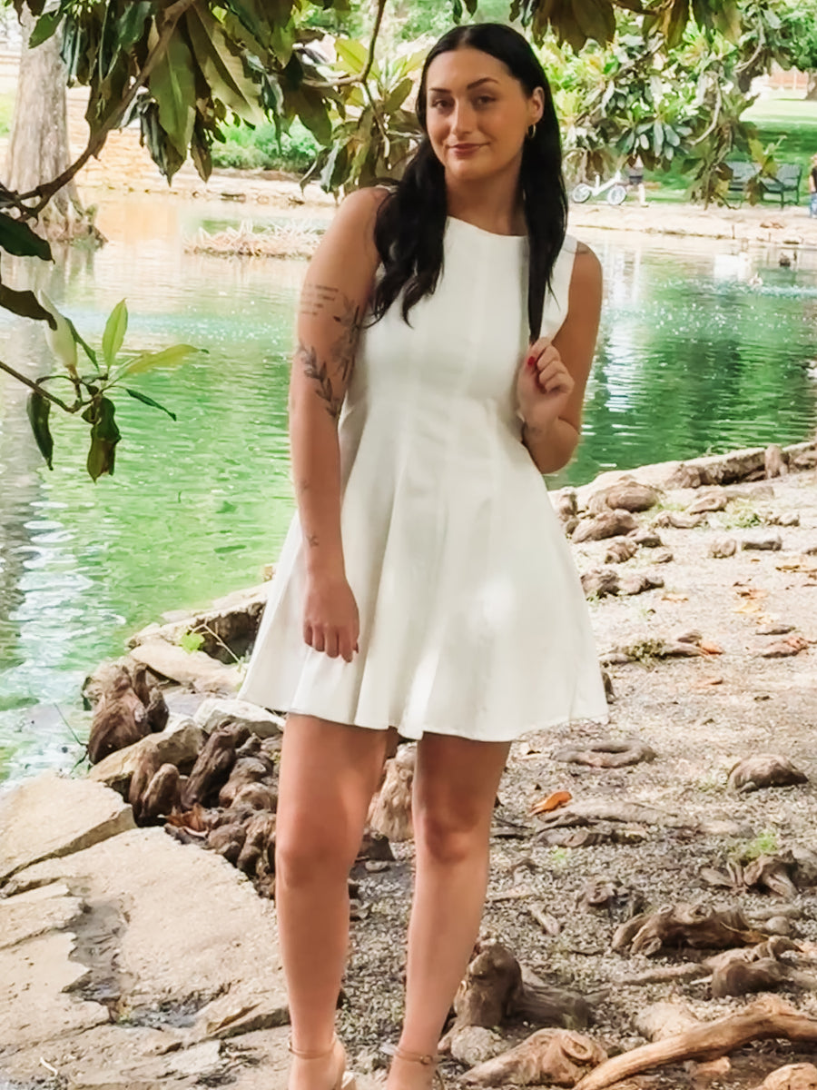 White sleeveless tank dress with seaming by Steve Madden.