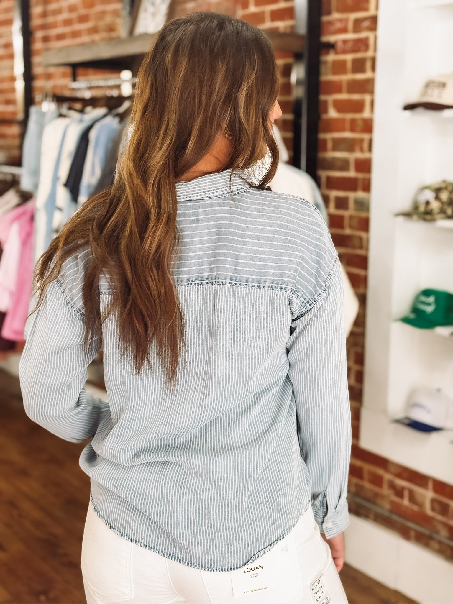 Light wash denim blouse with multi white stripes and button-up front