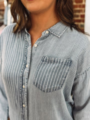 Light wash denim blouse with multi white stripes and button-up front