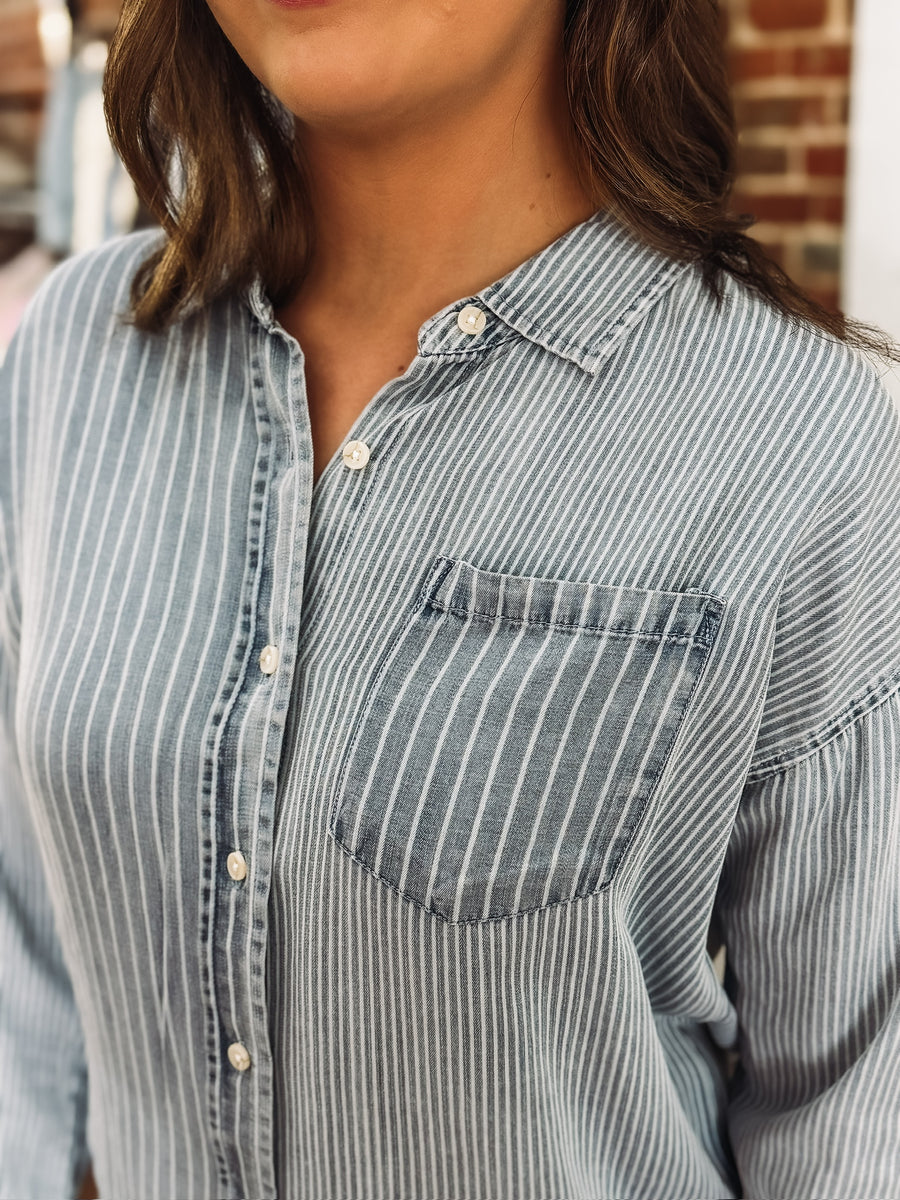 Light wash denim blouse with multi white stripes and button-up front