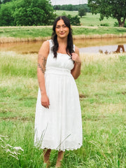 White eyelet sleeveless midi dress.