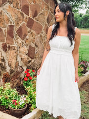 White eyelet sleeveless midi dress.
