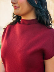 Wine colored short sleeve mock neck mini  dress in a sweater material.