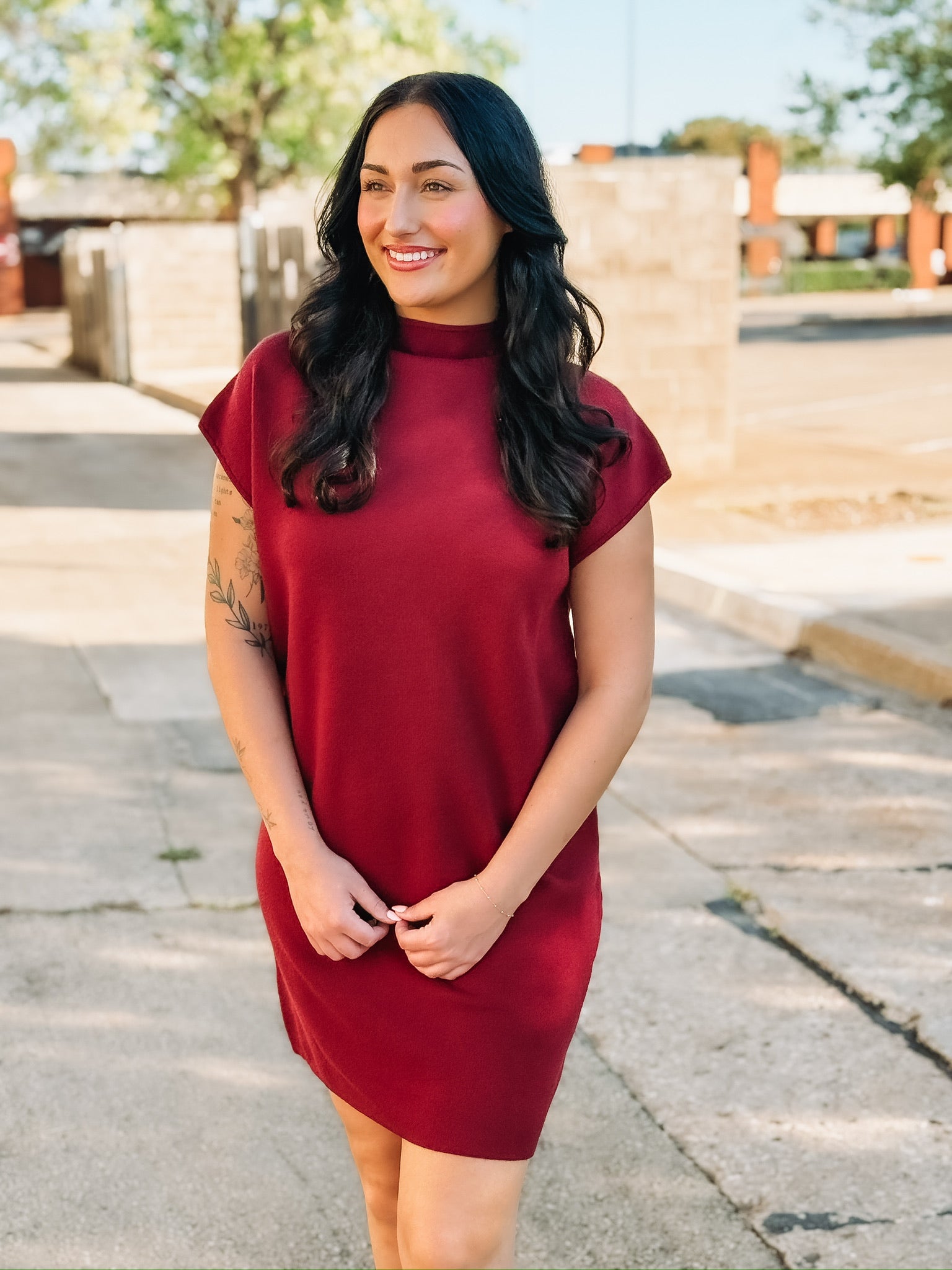 Wine colored short sleeve mock neck mini  dress in a sweater material.
