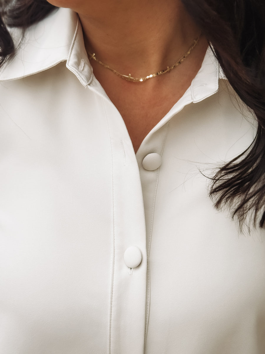 closeup of woman in cream tonal dress